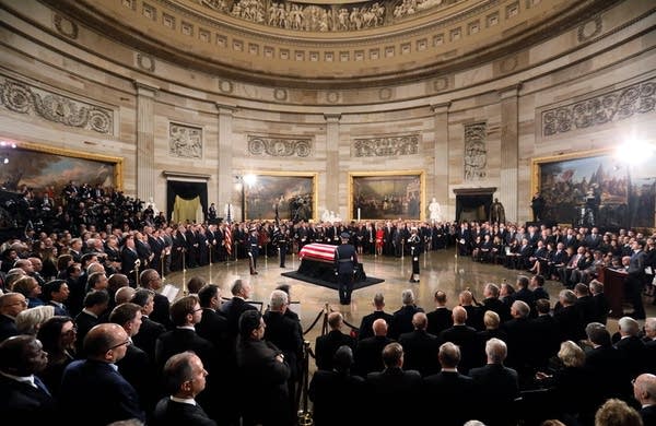 The casket of former President George H.W. Bush lies in state.