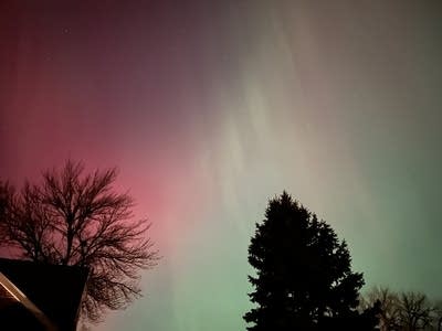 Red and green lights cover the night sky.