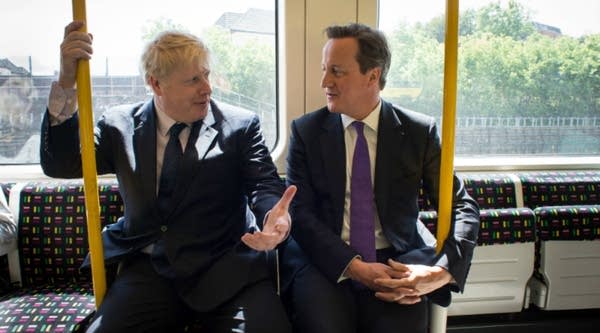 Mayor of London Boris Johnson and Prime Minister David Cameron sit on an underground train as they head back to Westminster.
