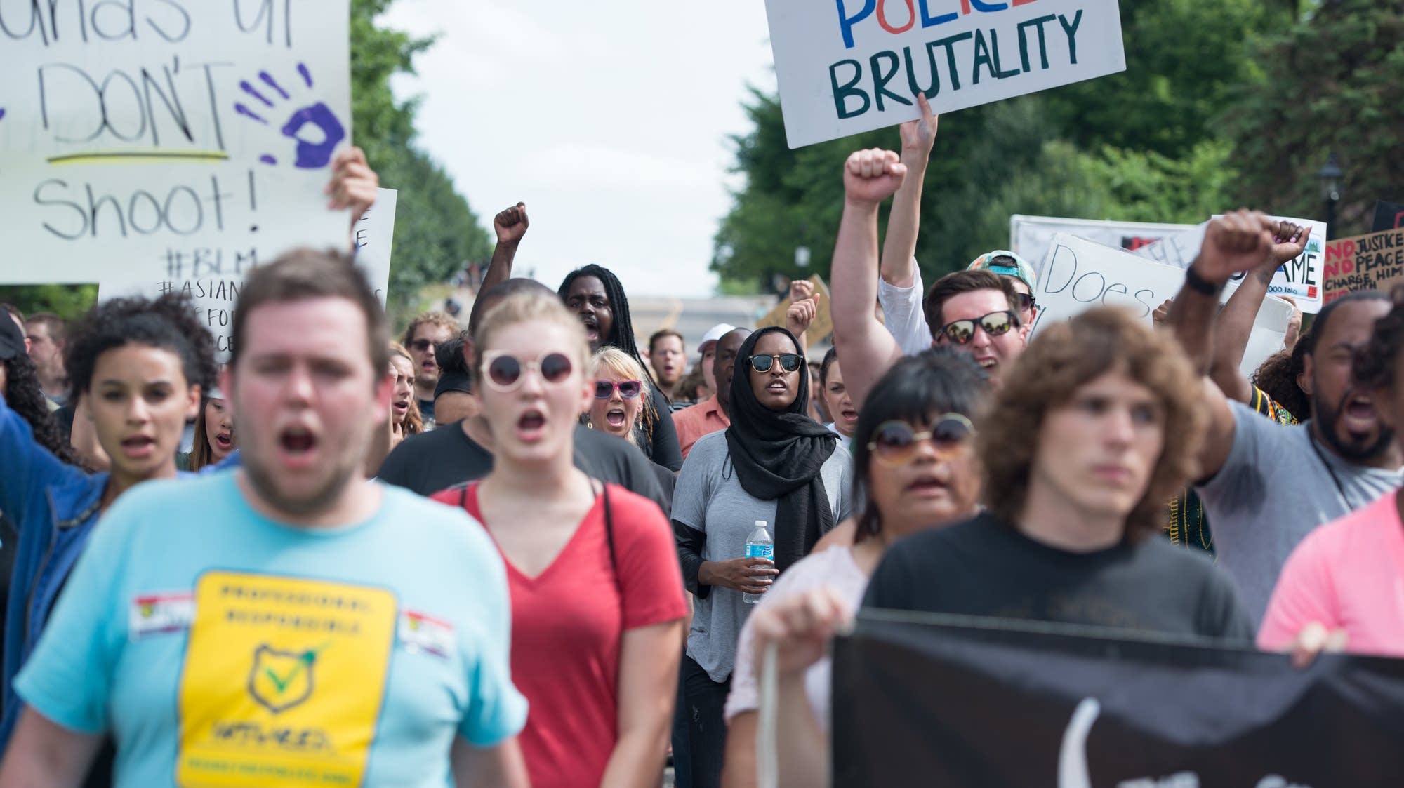 Protesters march from St. Anthony Village.