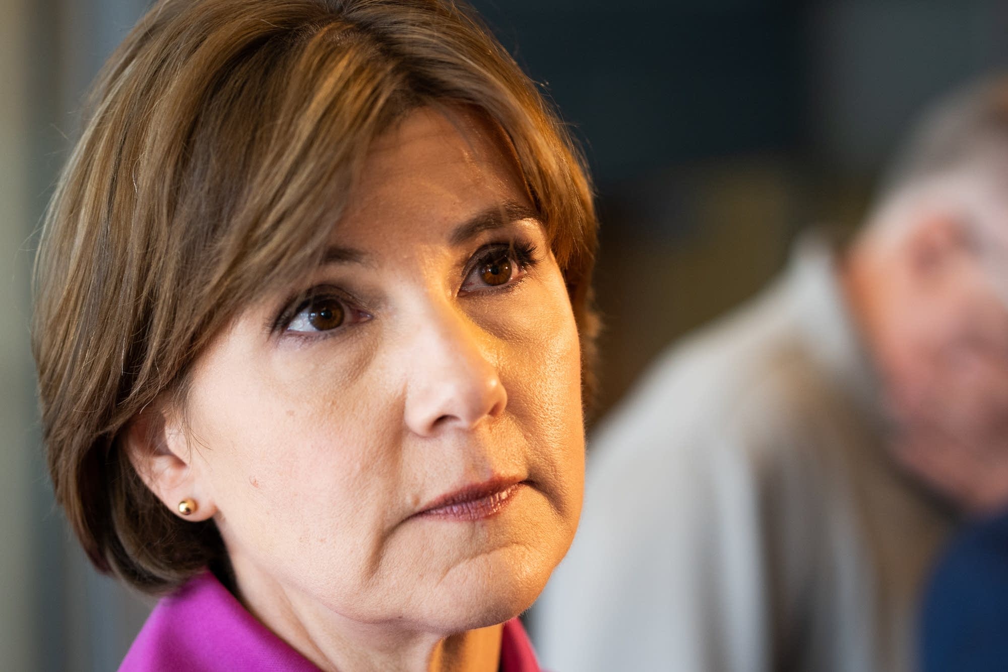 State Attorney General Lori Swanson listens to a question.