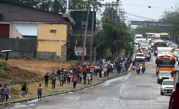 Honduran migrants leave the Metropolitan Center of San Pedro Sula, 300 kms north of Tegucigalpa, to travel to the Guatemala border.