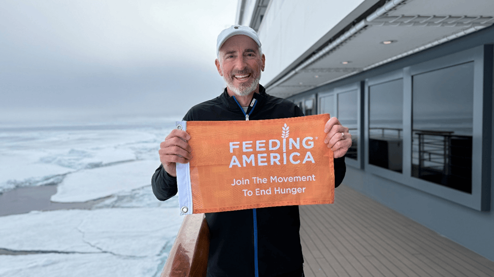A man poses for a flag
