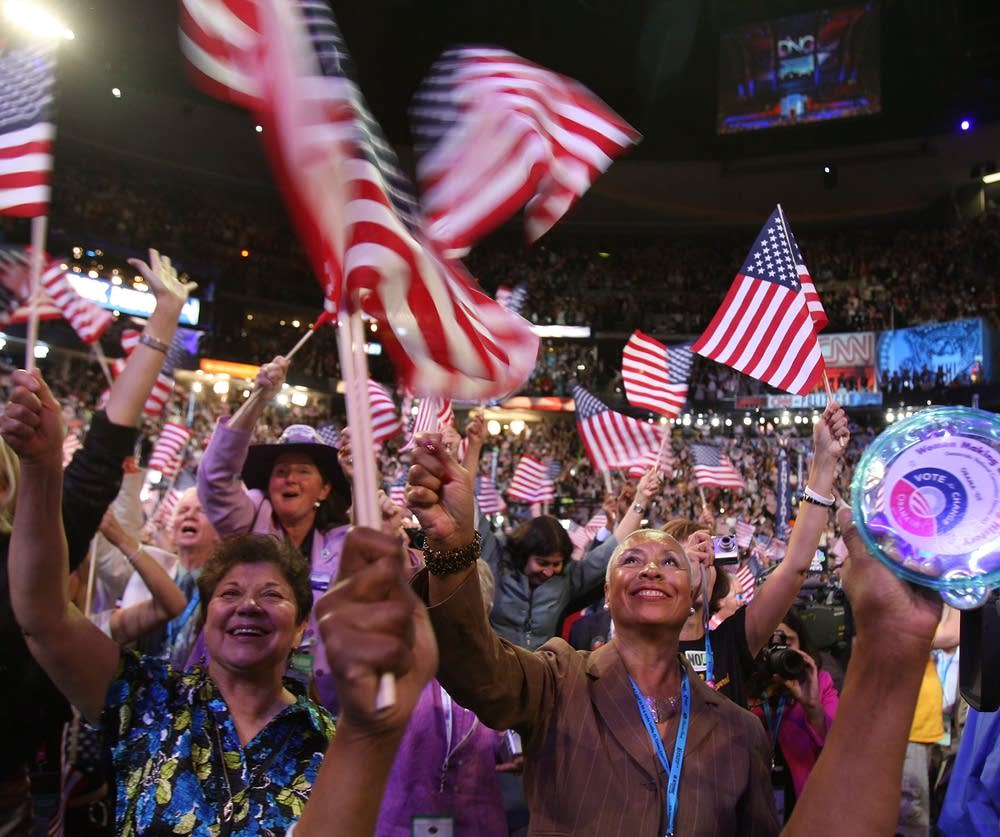 Delegates cheer during day three of the DNC
