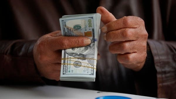 Bank profits drop amid competition for depositors