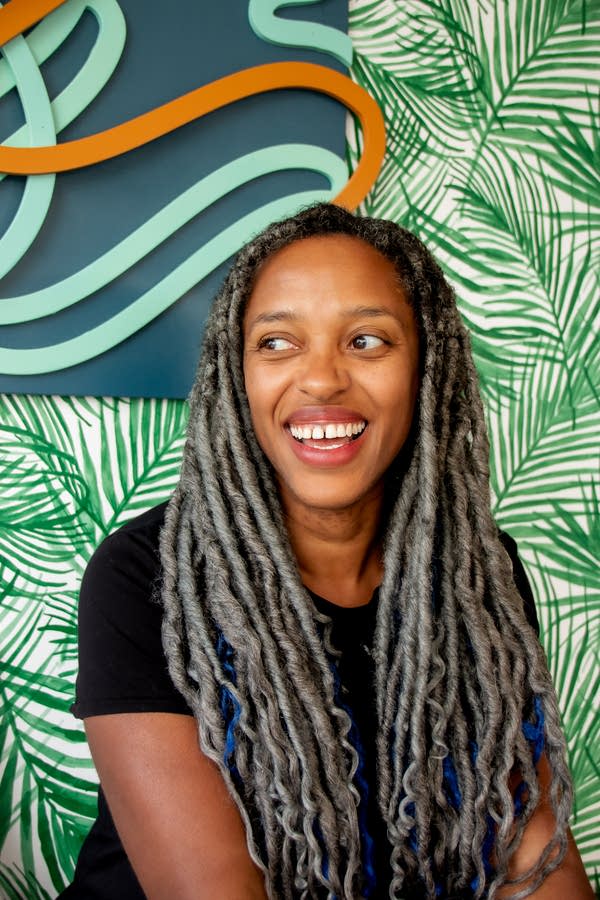 A woman poses for a portrait.