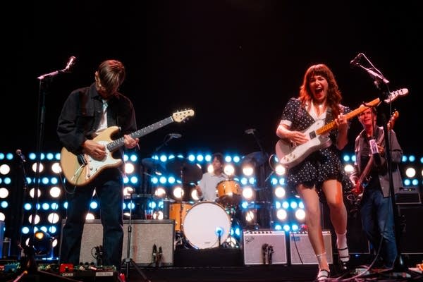 Rilo Kiley performing on stage