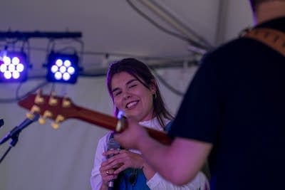 sara kae and her backing band performing on stage
