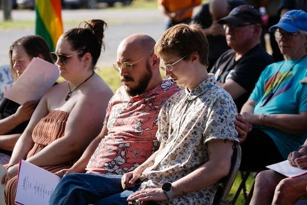 People sitting ouside in chairs