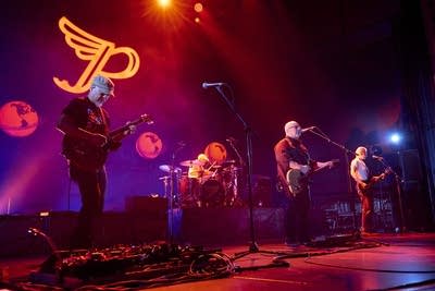the band pixies performing on stage