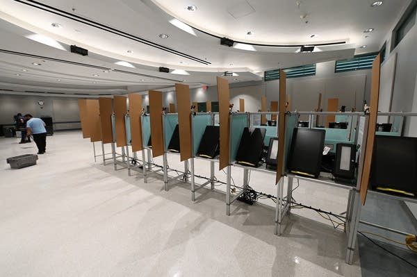 LAS VEGAS, NEVADA - OCTOBER 15:  Voting booths are set up with cardboard dividers placed between them as Clark County information technology department workers set up an early voting site at the Cora Coleman Sunrise Senior Center on October 15, 2020 in Las Vegas, Nevada. In-person early voting in the battleground state begins on October 17. All early voting locations in Clark County will also be mail ballot drop-off sites. Earlier this year, Nevada Gov. Steve Sisolak signed a bill mandating that all registered voters in the state receive a mail-in ballot for the first time to help keep people safe from the coronavirus (COVID-19).  (Photo by Ethan Miller/Getty Images)
