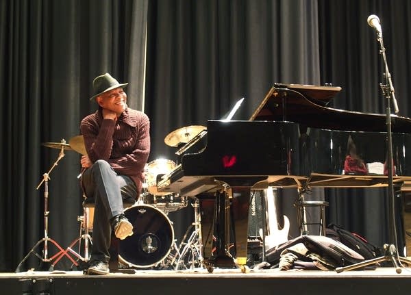 Singer Dennis Spears, one of the organizers, listens during rehearsal.