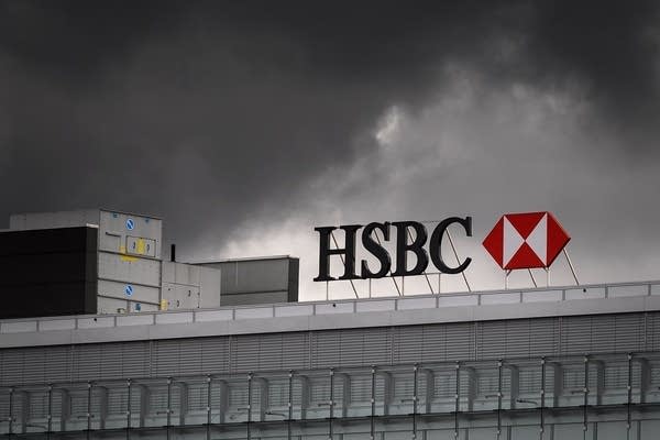 Pre-tax profits at HSBC have almost halved.