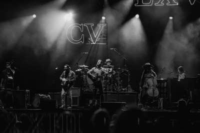 A band performing on an outdoor stage