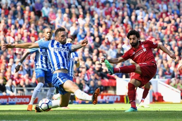 Mohamed Salah of Liverpool scores his sides first goal during the Premier League match between Liverpool and Brighton and Hove Albion at Anfield on May 13, 2018 in Liverpool, England. Salah is one of Mark Wheat's favorite players.