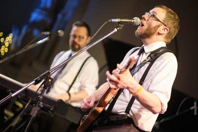 Two musicians performing onstage