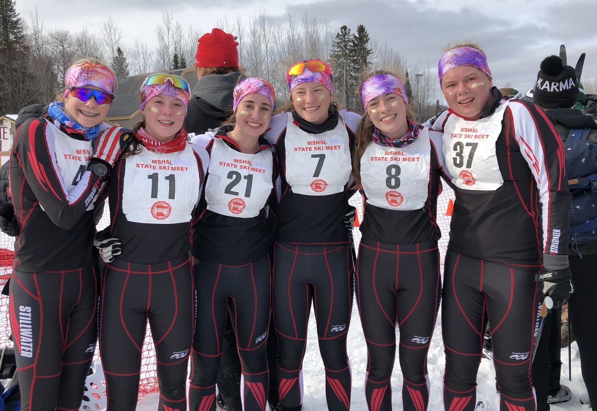 Stillwater girls cross country ski team wears glitter, Diggins-style.