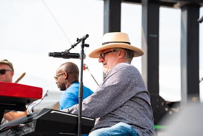 A band performing on an outdoor stage