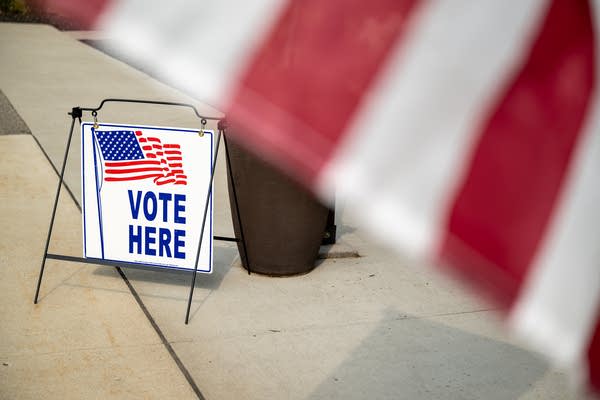 A vote here sign is seen 