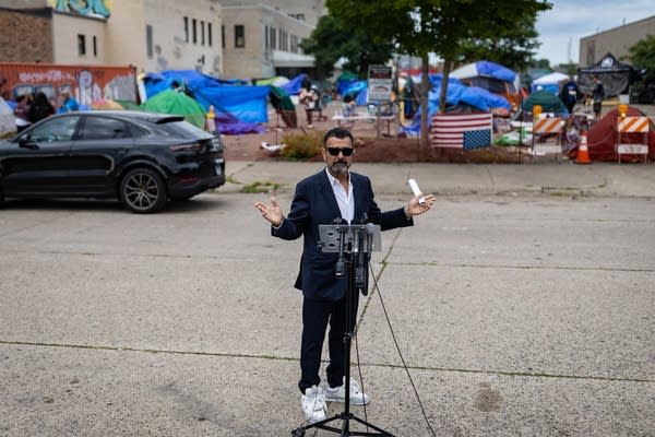 A man talks at a press conference