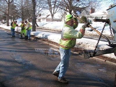 Steve Darwitz shoveling asphalt