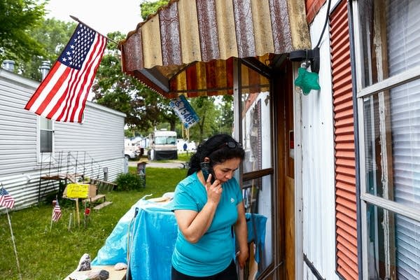 Antonia Alvarez calls neighbor Bill McConnell.