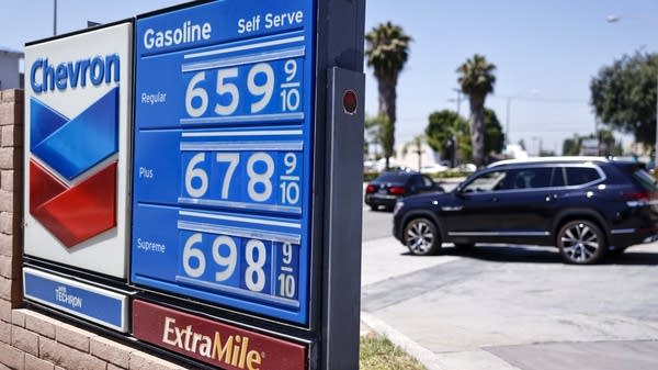 Gas prices displayed at a California gas station on May 11. Consumers are bracing themselves for gas price increases to pass through to other sectors, and for inflation to rise.