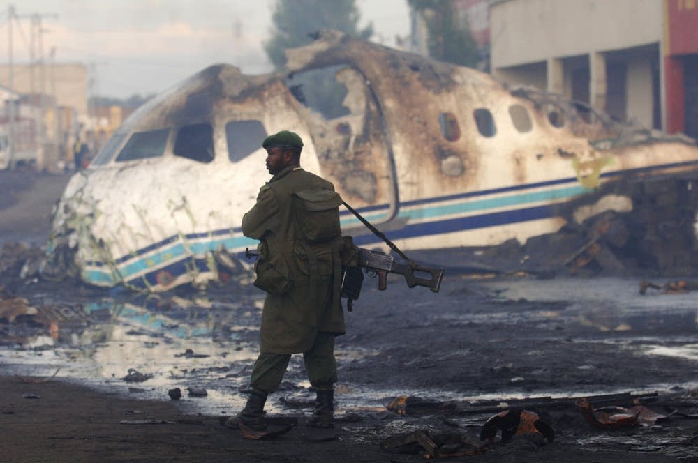 A soldier stands guard at the crash site