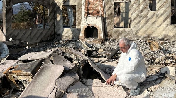 Above, Marketplace’s David Brancaccio in the rubble of his Altadena home in January 2025.