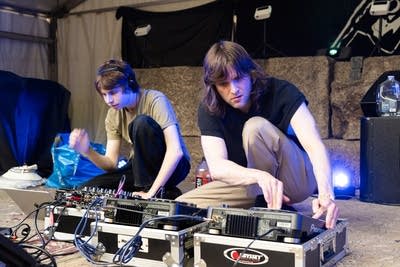 the band whole earth performing music outdoors