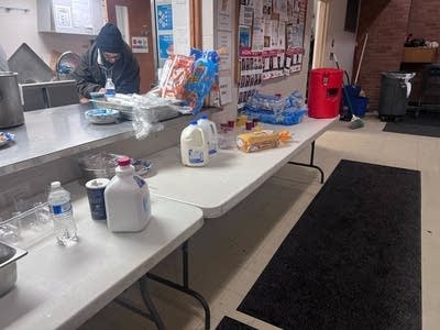 A table holds milk and food.