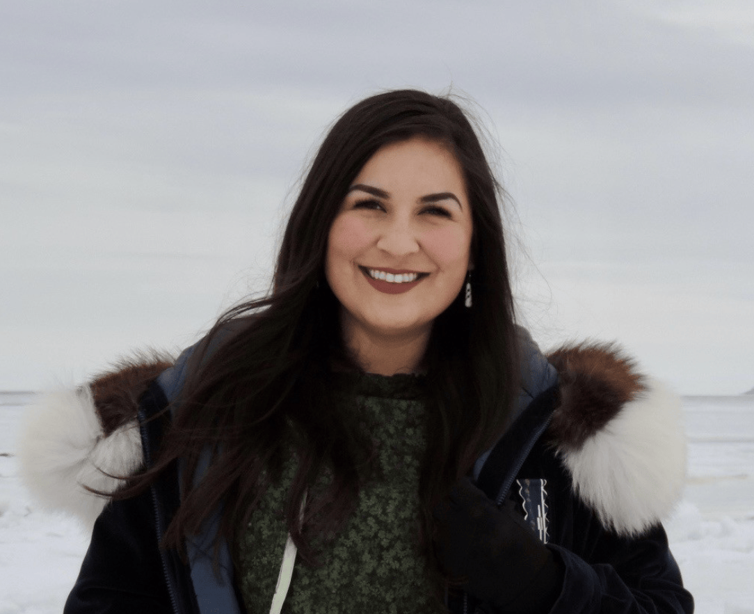 a woman poses for a photo