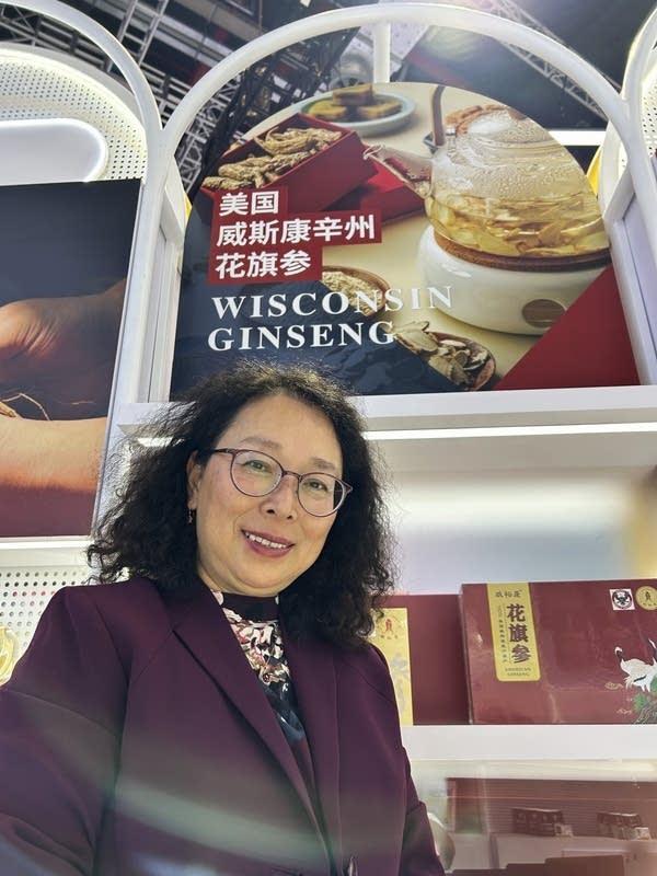 Shannon Su stands in front of her U.S. ginseng products she sells into China at the 2025 China import expo