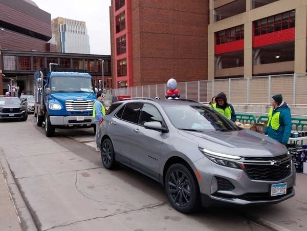 A line of cars waiting for free food