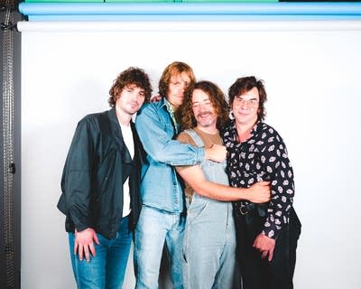 members of the band night moves pose for a photo