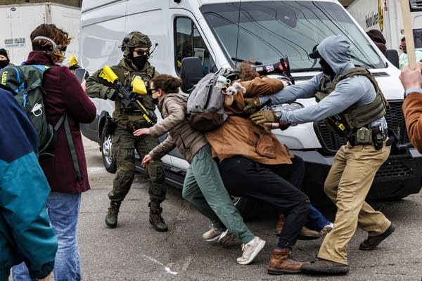 Protesters and law enforcement clash.
