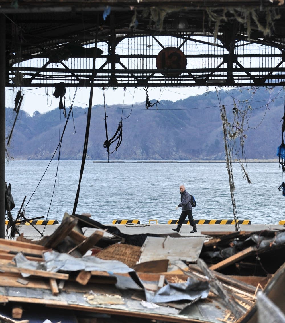 A man walks along a dock in Japan
