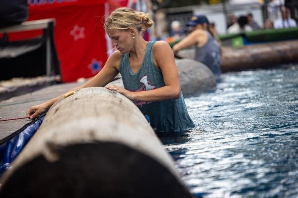 A woman stands in a pool