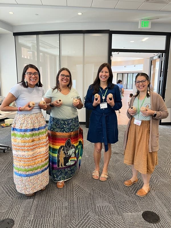 Four women pose for a photo