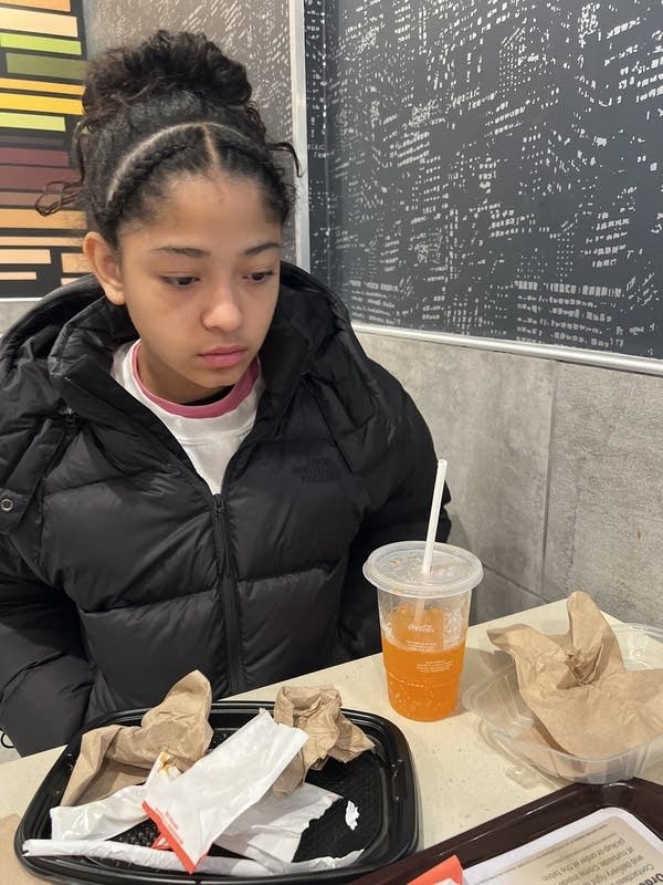 girls looks at table with food