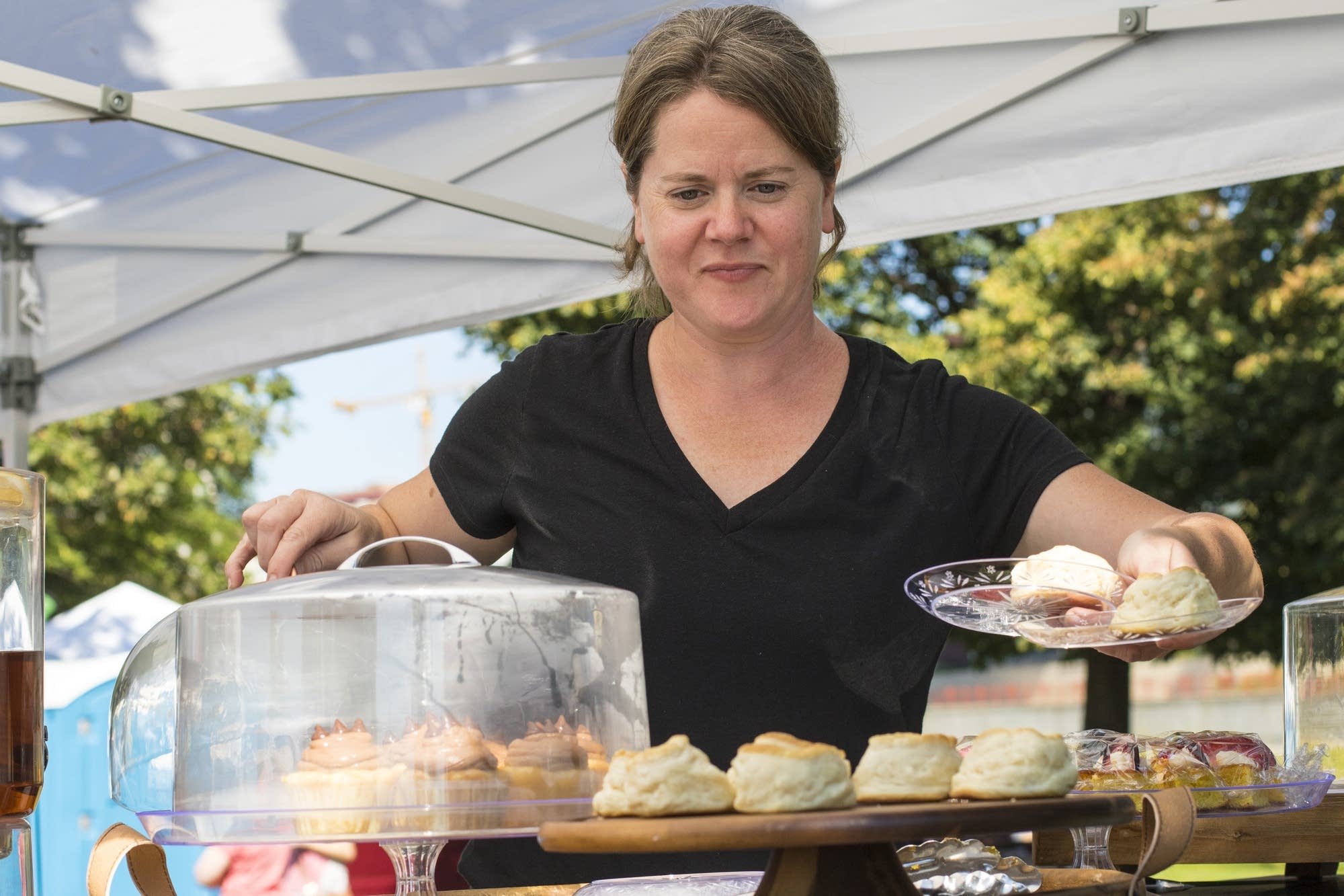 Deidre Conroy serves up a plate of homemade scones.