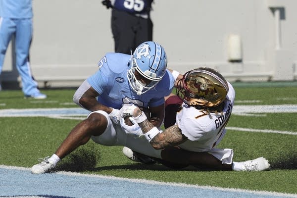 player in powder blue jersey catches ball 