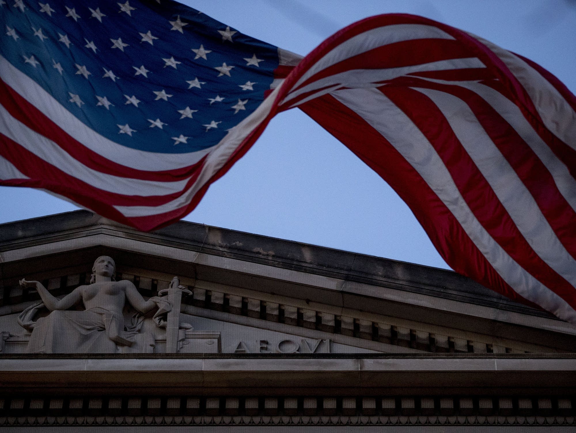 An American flag flies outside the Department of Justice