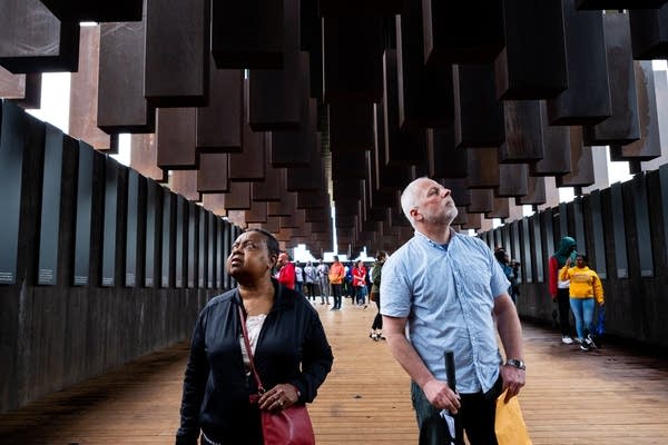 Virginia Huston and Warren Read take in the memorial together.