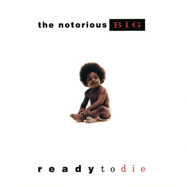 A baby sits in the middle of a white album cover.
