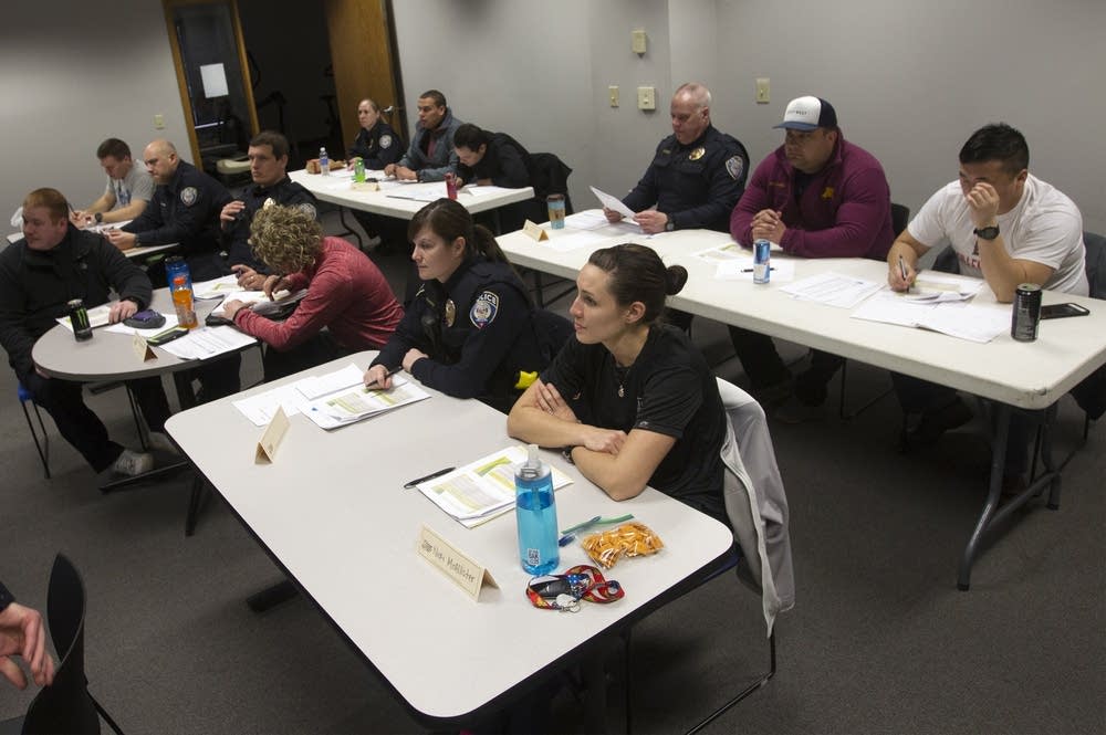 Metro Transit officers listen during class.