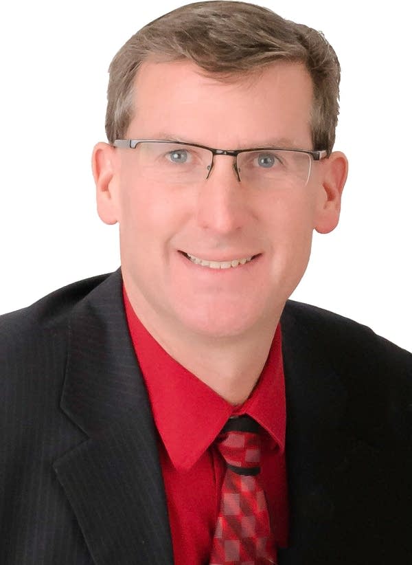 man smiling in headshot