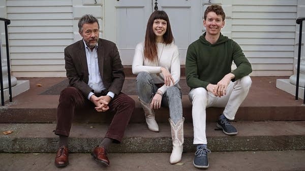 Poster Lark Roman Meyer Trio sets on steps outside a house