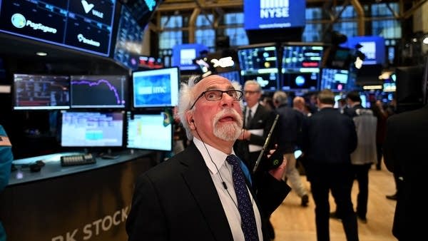Traders work during the opening bell at the New York Stock Exchange on Monday.