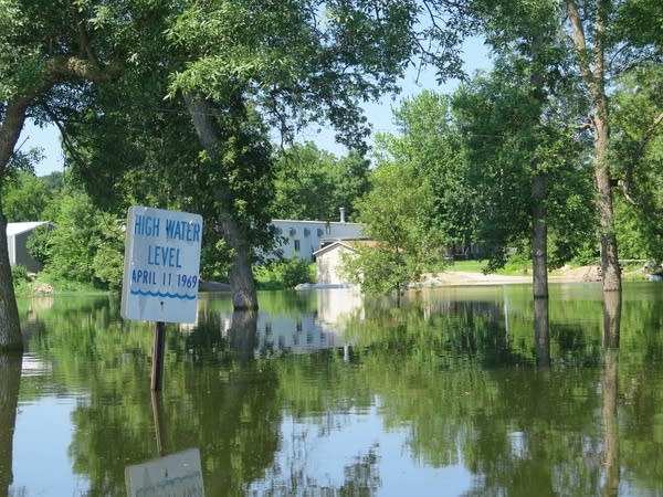 A sign showing the all-time flood crest of the west fork